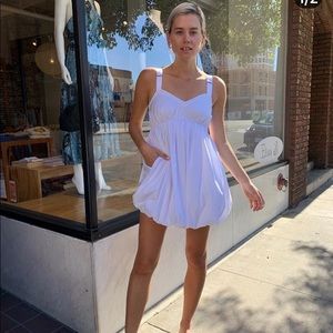 Floaty and elegant white bubble hem mini dress